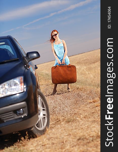 Young girl near the car