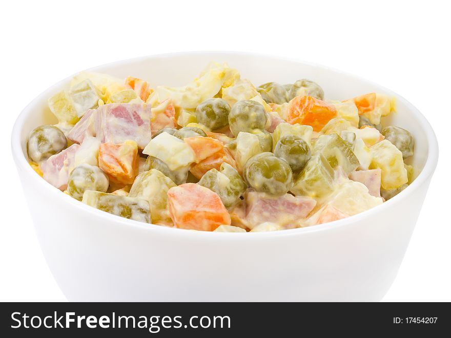 Russian salad in bowl, isolated on white