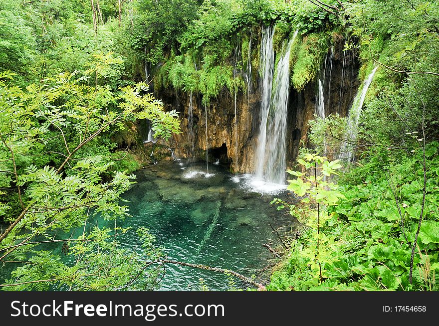 Beautiful waterfall in the forest, fresh clean water, trees. Beautiful waterfall in the forest, fresh clean water, trees