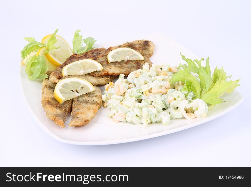 Fried fish with side salad