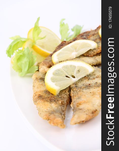 Fried fish decorated with lemon