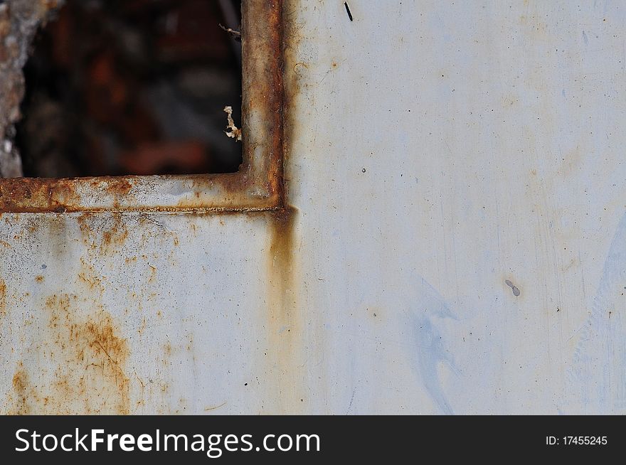 Scratched and rusted old metal wicket. Scratched and rusted old metal wicket