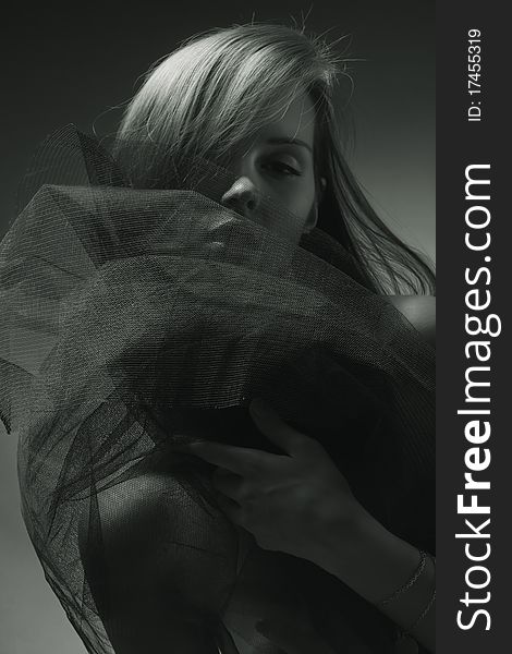 Face trough fishnet monochrome sensual portrait