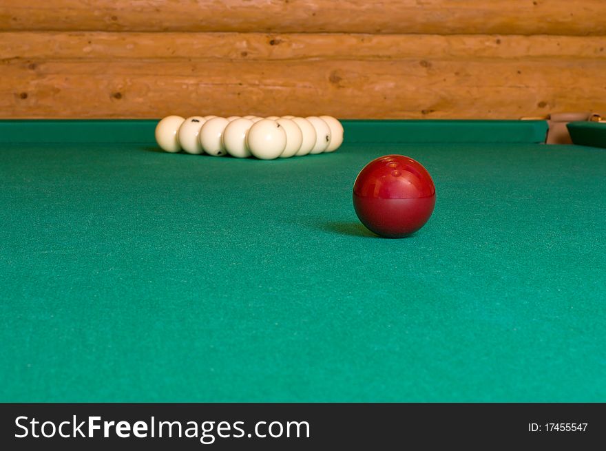 Balls for Russian billiards on a table with green baize. Balls for Russian billiards on a table with green baize.