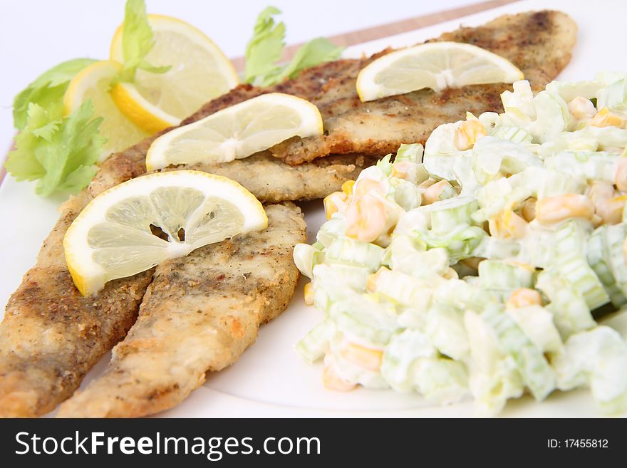 Fried fish with side salad