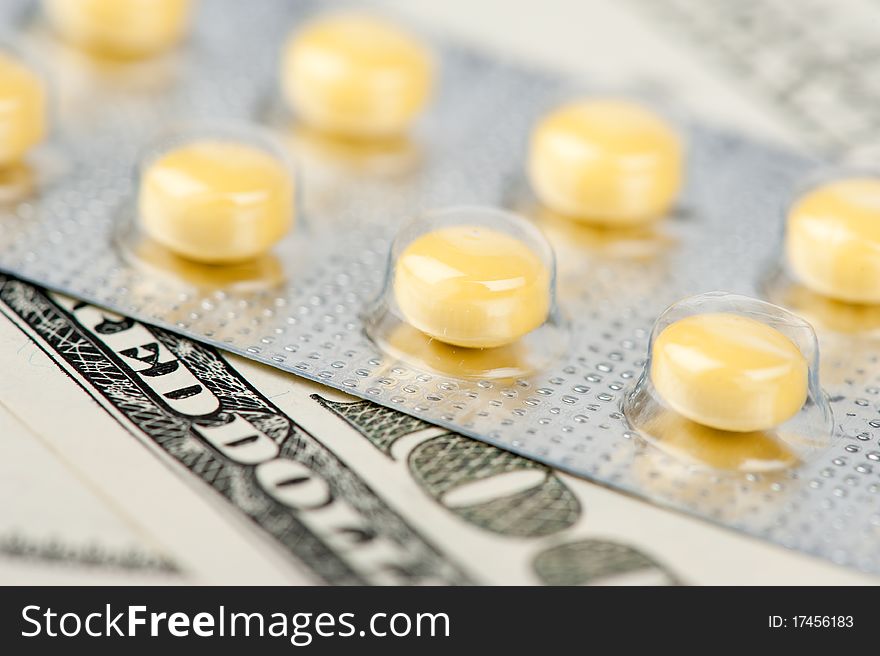 Pills and money, abstract business medical background