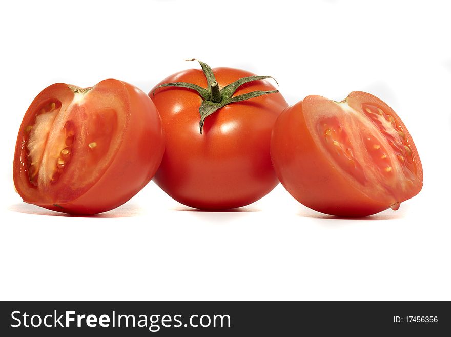 Close view detail of a bunch of  red tomatoes isolated on a white background.