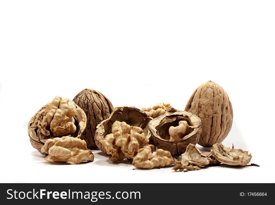 Close view detail of  some walnuts  isolated on a white background. Close view detail of  some walnuts  isolated on a white background.