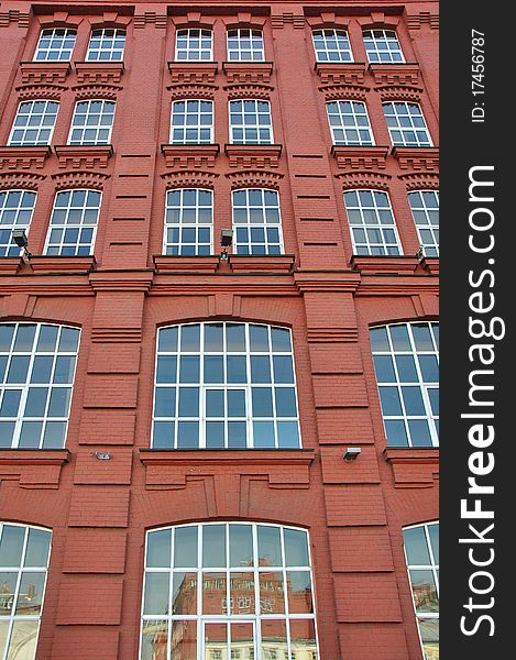 Old brick building with new windows.