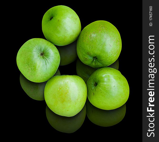 Five green Jujube on Black table and Reflect