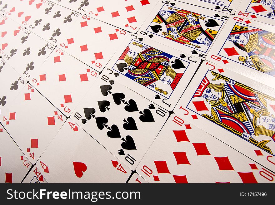 Close-up of Poker cards and gambling chips on green background