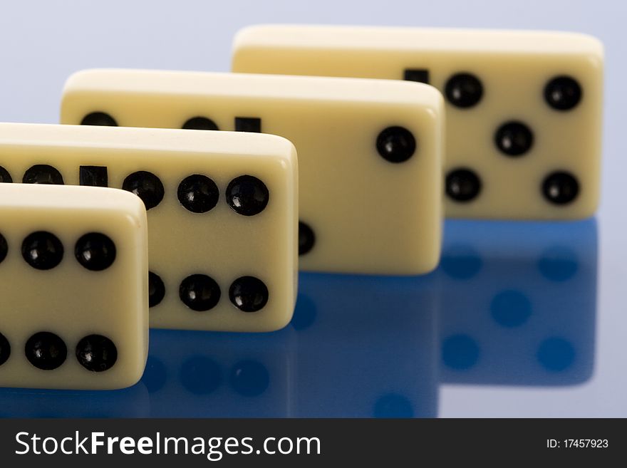 Close-up of domino on blue background