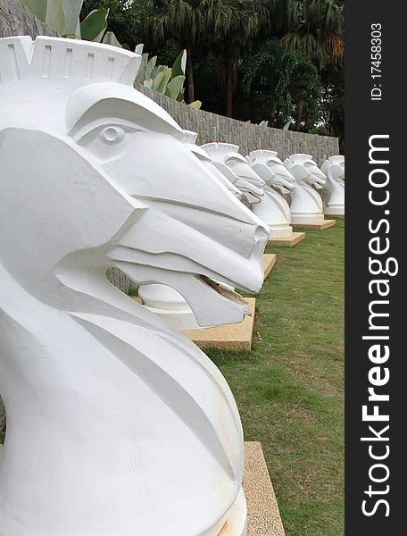 White decorative concrete replica of trojan horses.
