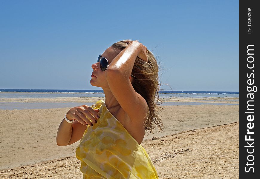 The Young Girl On A Beach