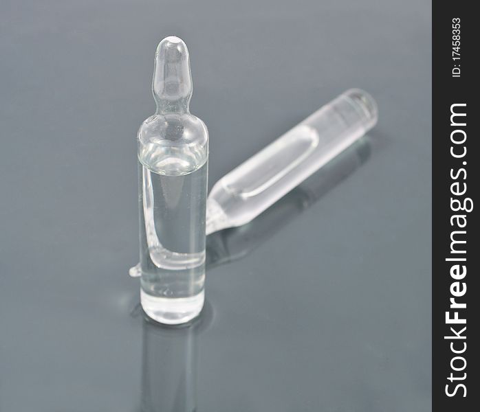 Vial with a gray background