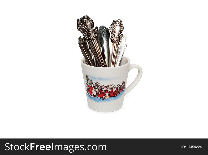 Cup and tablespoons white background