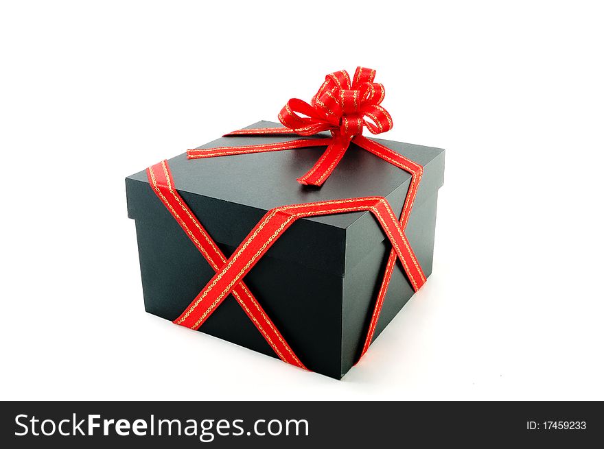 One gift box with a red tape is isolated on a white background