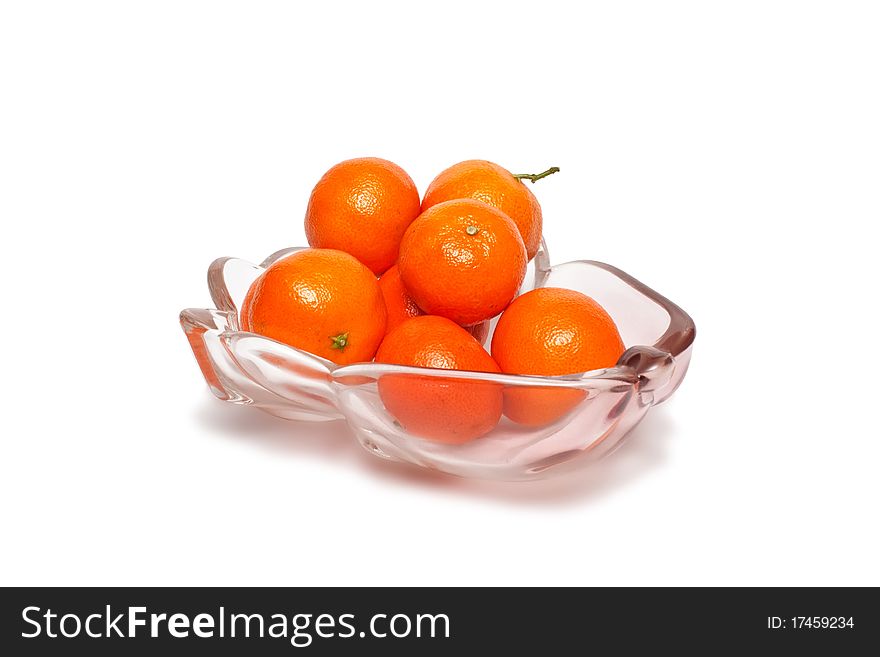 Plate full of fresh tangerines on white background