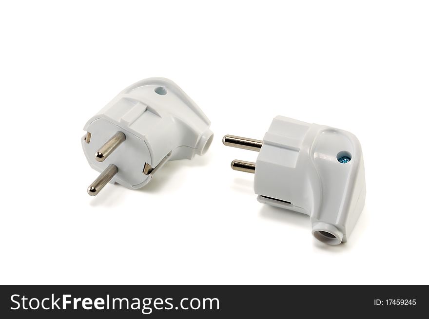 Two white plugs are isolated on a white background