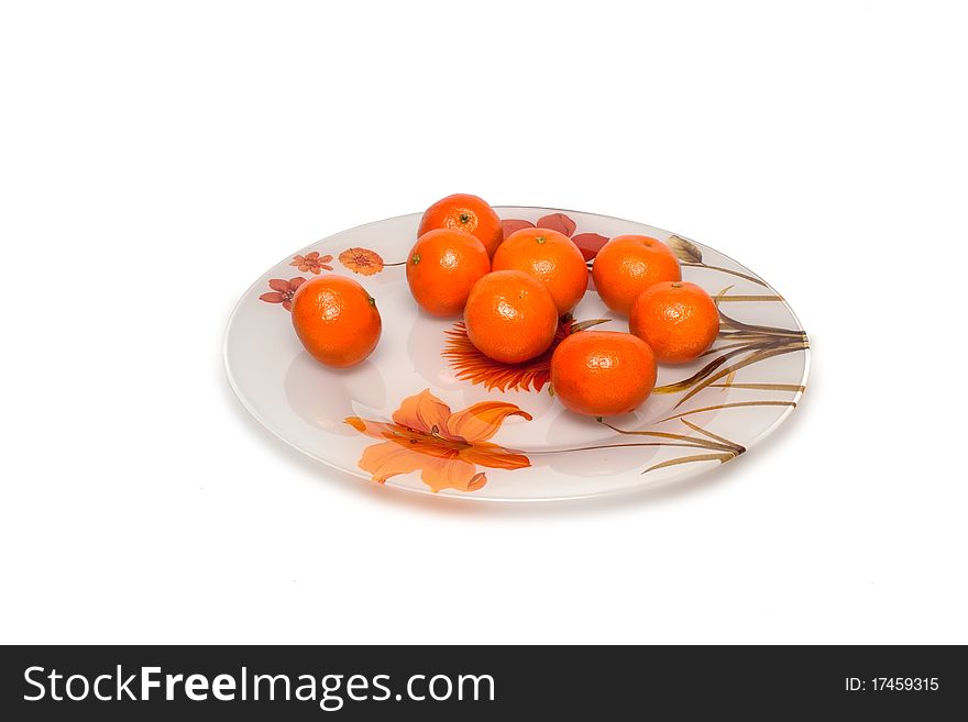 Plate on a white background with mandarins. Plate on a white background with mandarins