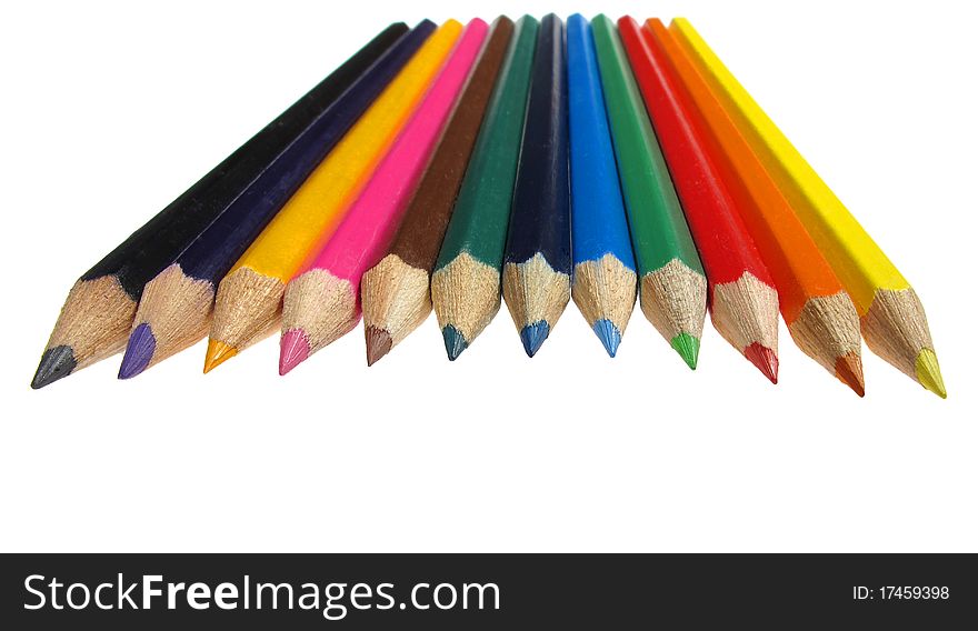 Colourful crayons in the row isolated over white background