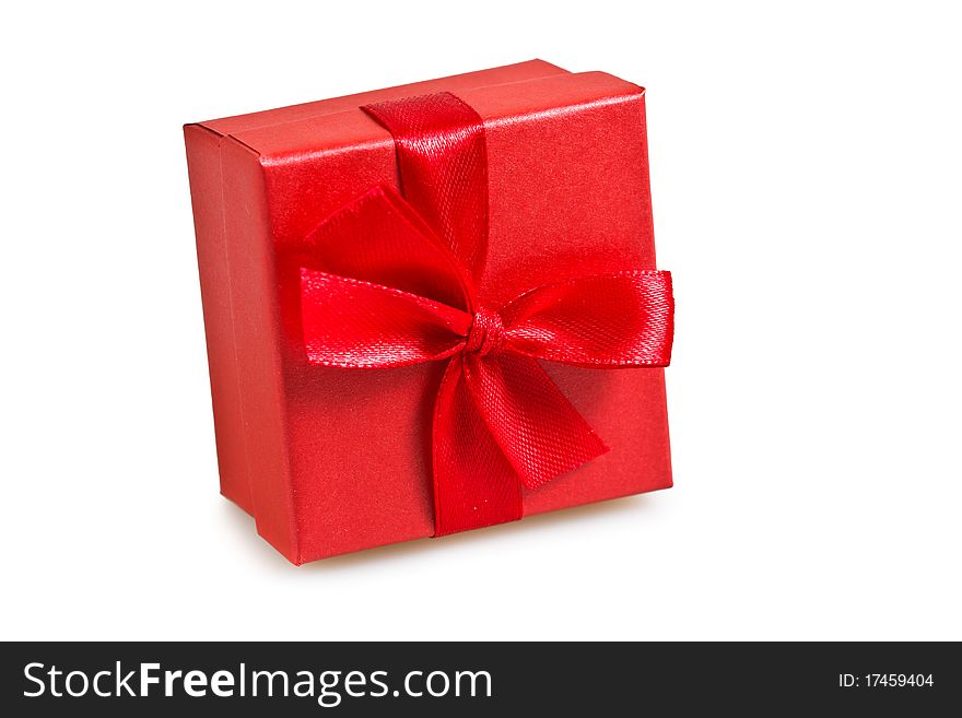 Gift in the red packing on a white background