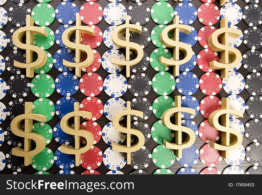 Multi - colored gambling chips and US dollar sign on a background