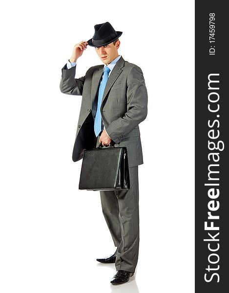 Young businessman in hat with briefcase in hand. Isolated on white