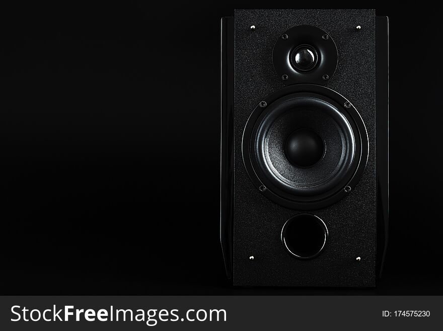 Audio speaker system on a black background. Minimalistic concept, free space