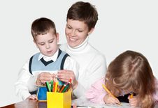 Mother And Children Together Paint An Album Royalty Free Stock Photos