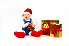 Little Boy In Santa Hat With A Bunch Of Gifts Stock Photos Little Boy In Santa Hat With A Bunch Of Gifts Stock Photos