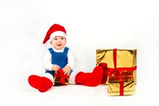 Little Boy In Santa Hat With A Bunch Of Gifts Stock Photo Little Boy In Santa Hat With A Bunch Of Gifts Stock Photo