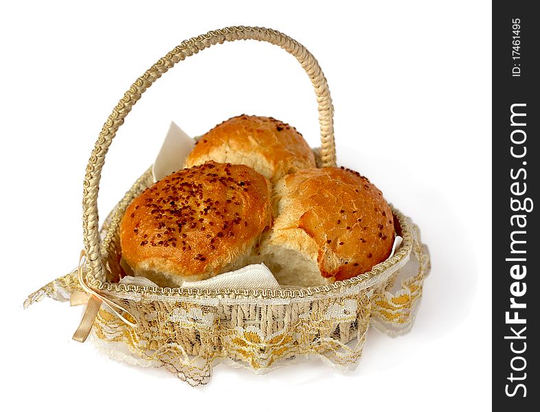 Bread in a wicker basket on a white background