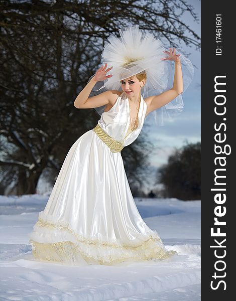 Portrait of the charming bride in the winter on snow. Portrait of the charming bride in the winter on snow.