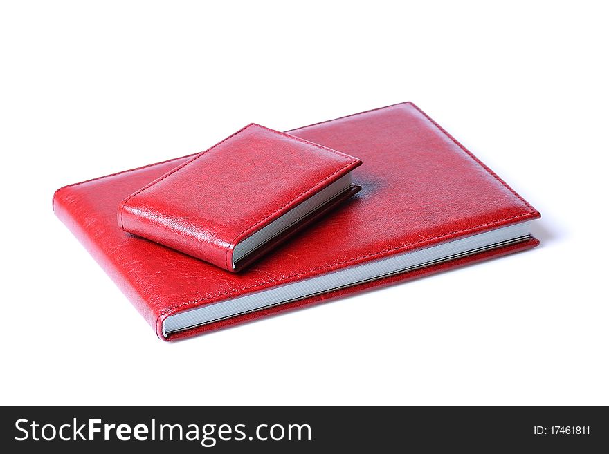 Two red books isolated over a white background.