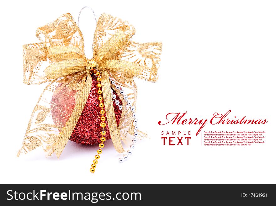 Red christmas balls and gold bow ribbon on white background with copy space