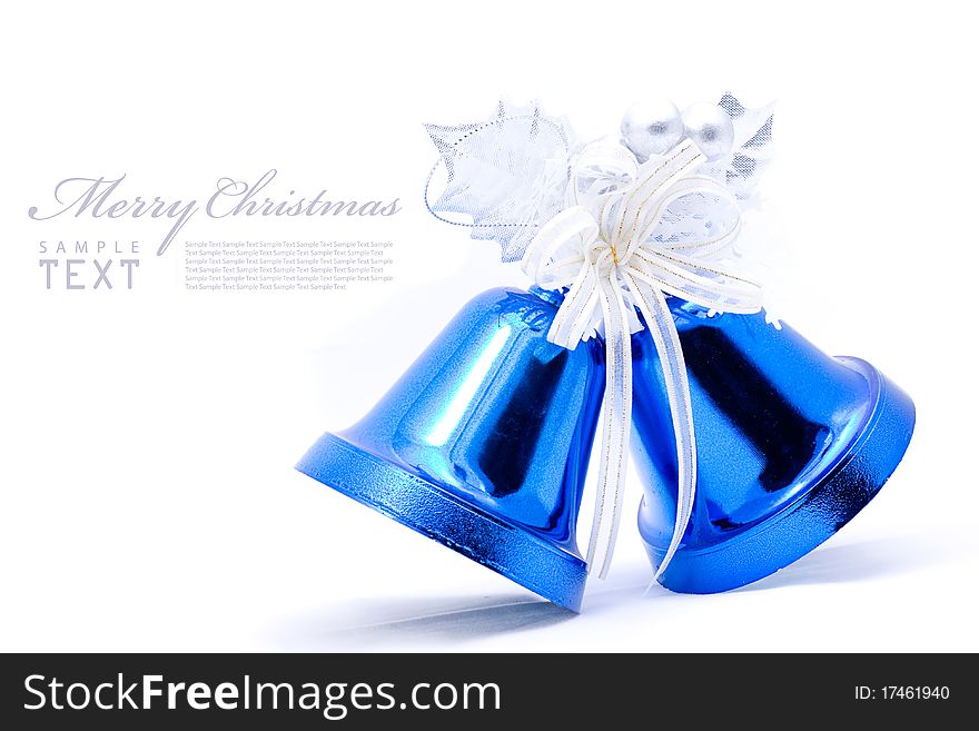 Blue christmas bell and silver bow ribon on white background with copy space. Blue christmas bell and silver bow ribon on white background with copy space