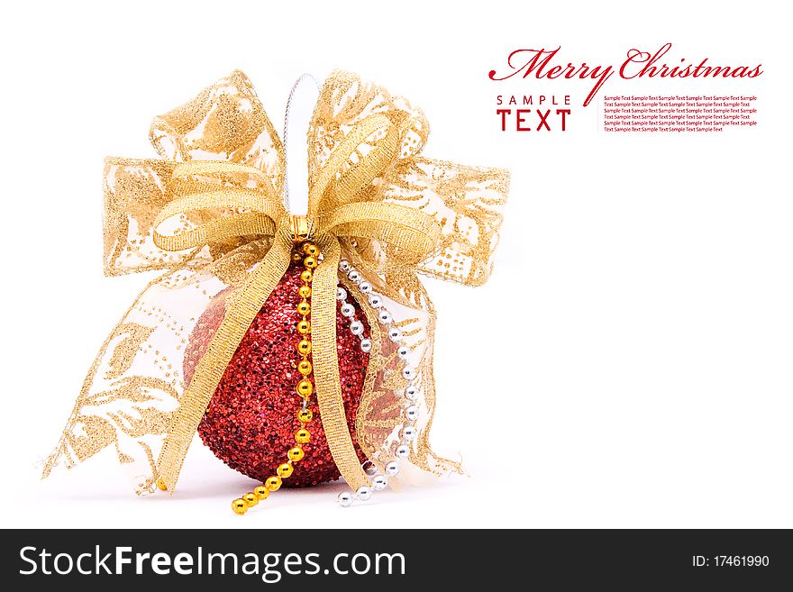 Red christmas balls and gold bow ribbon on white background with copy space