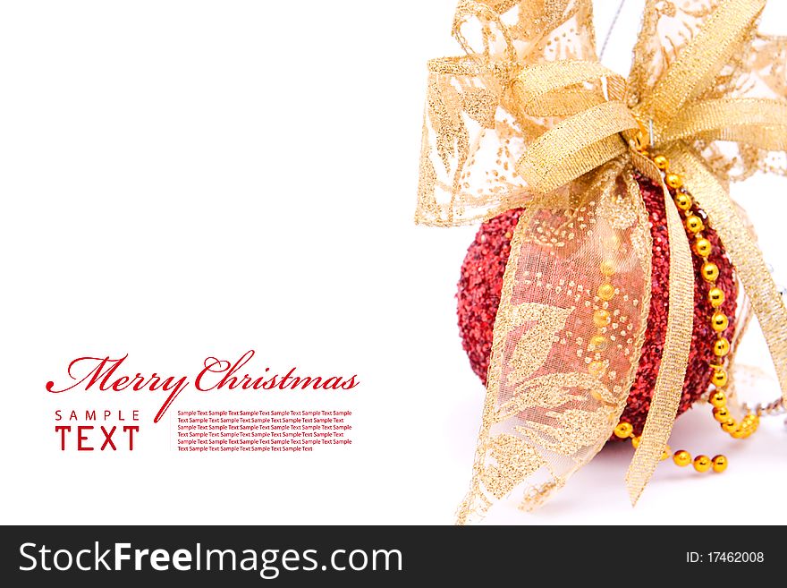 Red christmas balls and gold bow ribbon on white background with copy space