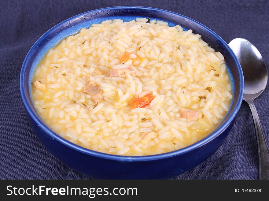 Bowl of rice with chicken and carrots
