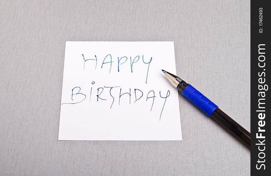 Happy Birthday message written on a white paper