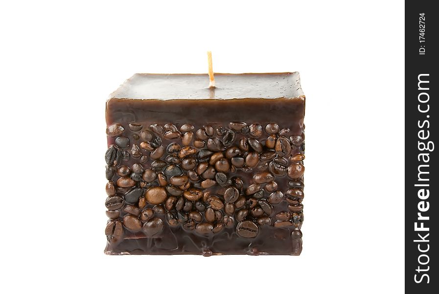 Coffee candle ornated with beans isolated on white