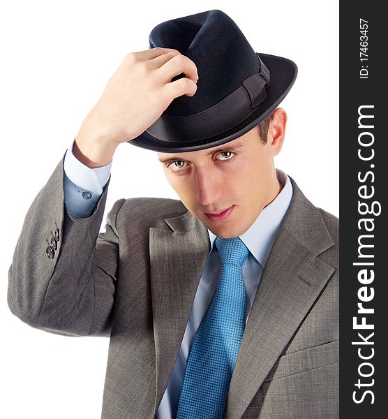 Portrait of young businessman in hat. Isolated on white