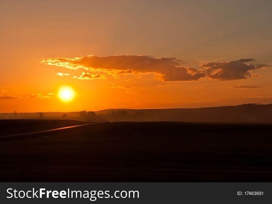 Sunset over the road running across the valley. Sunset over the road running across the valley