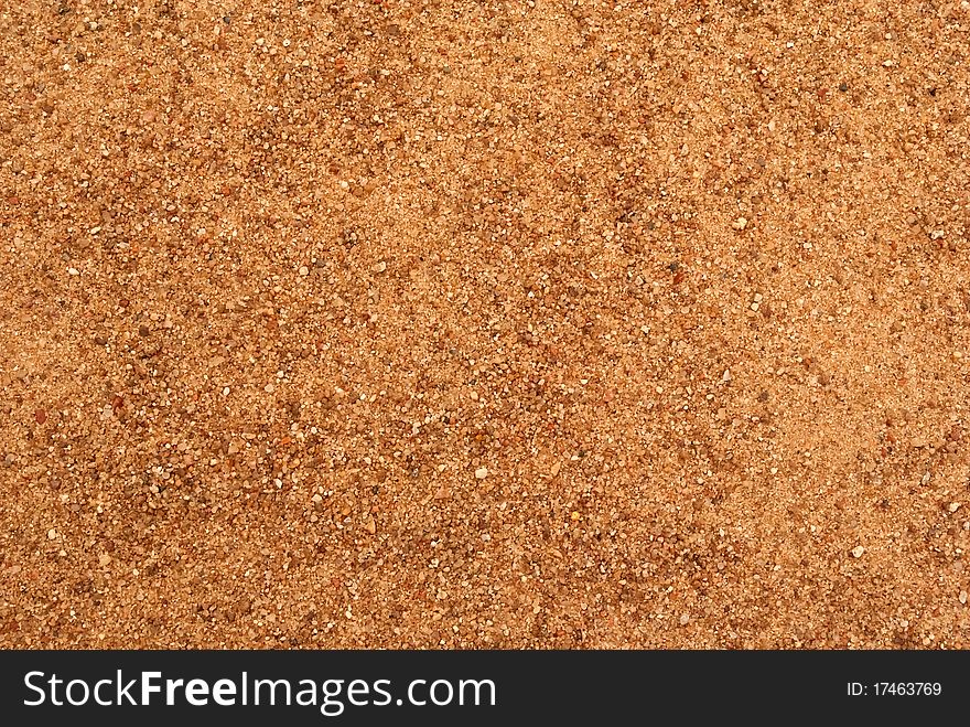Texture of orange larde sand grains. Texture of orange larde sand grains