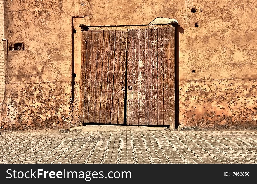 Very old wood door in sand wall. Very old wood door in sand wall