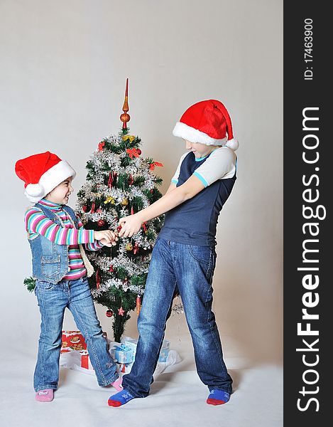 Kids fight because of decoration on Christmas tree. Kids fight because of decoration on Christmas tree