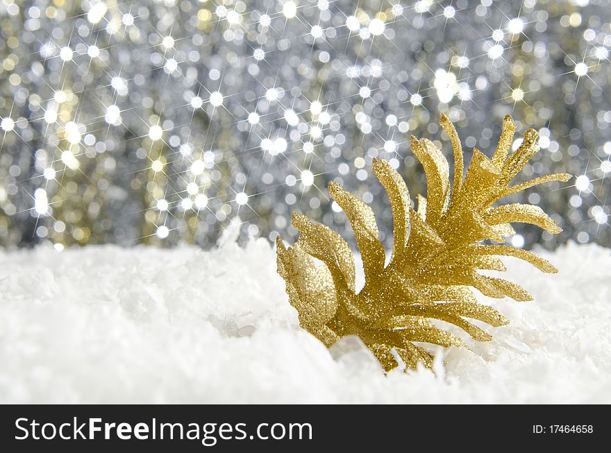 Golden Christmas decorations against a sparkling background