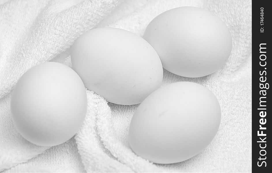 White eggs on a white terry towel