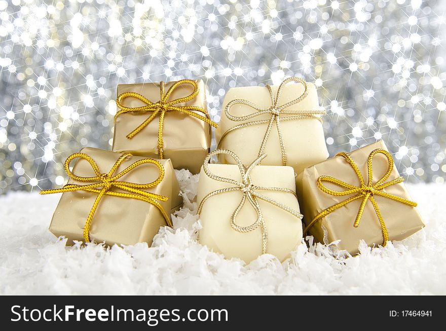 Golden Christmas decorations against a sparkling background